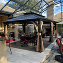 Outdoor hardtop gazebo with dining table, chairs, and string lights, a perfect patio shade solution.
