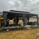 Grey hardtop gazebo with string lights and outdoor furniture on a patio, patio shade solutions.