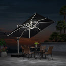 Black cantilever patio umbrella with integrated LED lights over outdoor dining set.