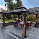 Bronze hardtop gazebo with curtains, dining set, and patio. Patio shade for outdoor relaxation and dining.