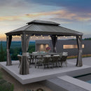 Grey hardtop gazebo with string lights, outdoor dining set and curtains on a patio, patio shade solutions.
