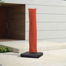 Orange patio umbrella cover on a black base, made of water-repellent polyester fabric.