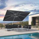 Outdoor patio set with black umbrella, sofa, and chairs