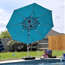 Blue cantilever umbrella over pool