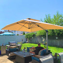 Man relaxing under a beige PURPLE LEAF cantilever patio umbrella in outdoor living space with seating and dining set.