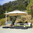 Beige square cantilever patio umbrella providing shade over a outdoor living room set.