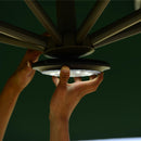 Installing a PURPLE LEAF patio umbrella light, showcasing the LED light fixture and umbrella frame.