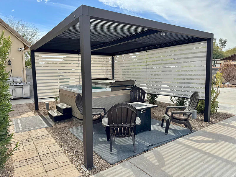 Aluminum louvered pergola with sleek design providing shade for a hot tub area