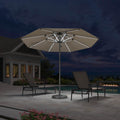 Purple Leaf semi-auto outdoor market umbrella with LED lights on patio at night.