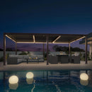 PURPLE LEAF Caesar bronze aluminum louvered pergola with integrated LED strip lights at night.
