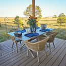 PURPLE LEAF outdoor dining set with X-frame aluminum table, woven rattan chairs & cushions on deck.