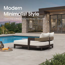 Modern outdoor daybed with cream cushions and woven backrest beside pool