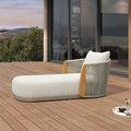 Khaki upholstered Olefin patio chaise lounge chair with teak armrests and rope detail.