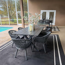 Purple Leaf grey wicker patio dining set with table and chairs beside pool