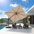 Beige cantilever patio umbrella providing shade over outdoor seating with a view of the sea and mountains