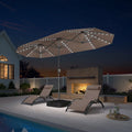 PURPLE LEAF 13'X7' double-sided large patio market taupe umbrella with light and free base .The LED light strips under the umbrella illuminate the lounge chairs and the swimming pool, creating a warm and cozy atmosphere.