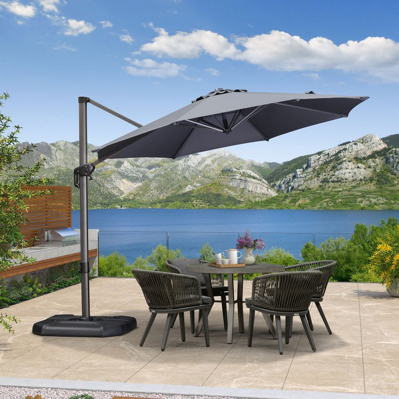 Grey cantilever patio umbrella with table and chairs, patio shade solution