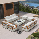 White modular patio conversation set with white cushions and wooden frame, featuring a coffee table and ottomans.