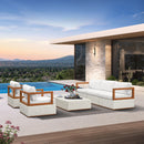 White PURPLE LEAF Griffin patio set with wooden frame and woven base, next to a pool.