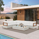 White L-shaped sectional patio conversation set with a white woven ottoman and aluminum frame with wood accents.