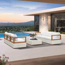 White PURPLE LEAF Griffin patio conversation set with ottoman and coffee table on modern patio with pool view.